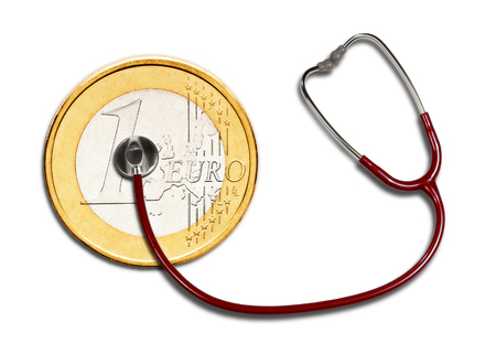 A one euro coin is monitored with a stethoscope の写真素材