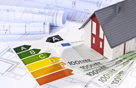 Architectural model, architectural plans, energy efficiency labels and moneyの写真素材