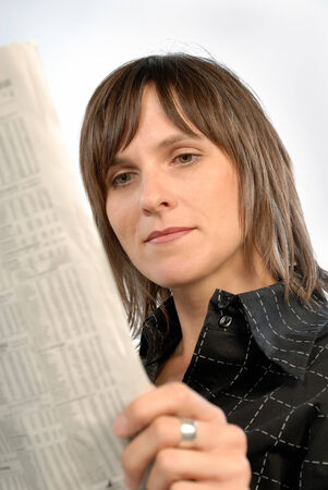 Businesswoman reading the newspaper の写真素材