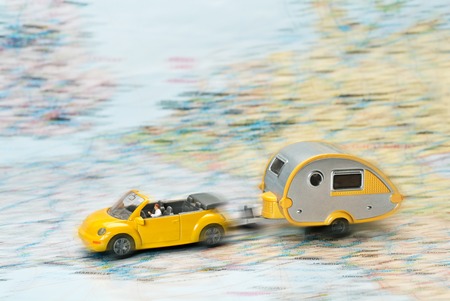 Car with caravan moves on Map of Europe の写真素材