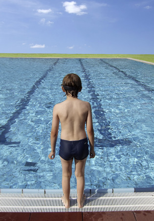 Boy at a large pool の写真素材
