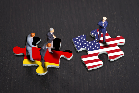 Puzzle pieces with the flags of Germany and the USA Puzzle pieces with the flags of Germany and the USA