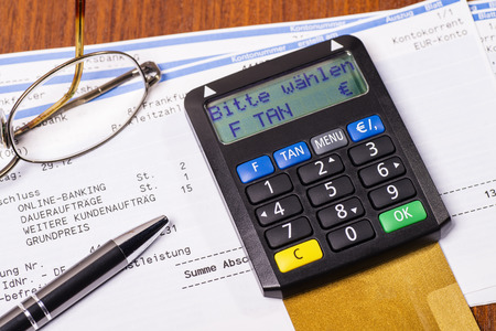 Tan generator with check card and statement of bank accountの写真素材