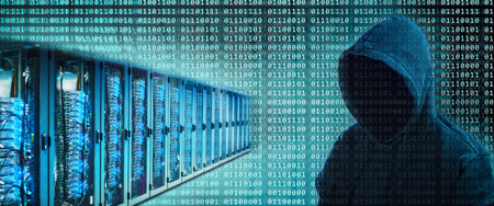 A number of servers with binary digits and the silhouette of a hackerの写真素材