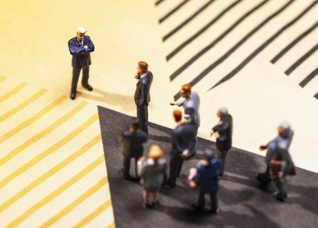 A group of figures with one figure as leaderの写真素材