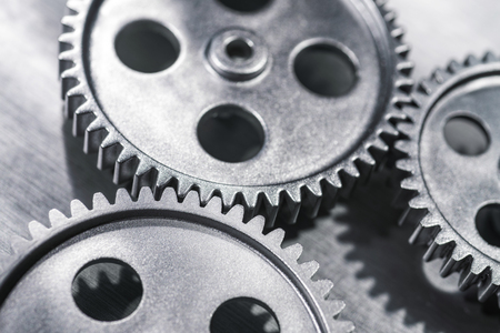 Close-up view of three gears meshing.の写真素材