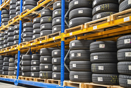 High rack with customer tires in a warehouse of a motor vehicle workshopのeditorial素材
