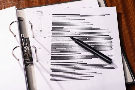 Opened file folder with a predominantly blackened side