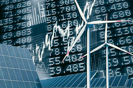 Wind turbines and solar panel with price board, stock prices and diagramsの写真素材