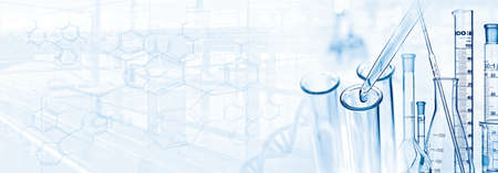 Scene from the laboratory with pipette, test tube, microscope, DNA and formulas with copy spaceの写真素材