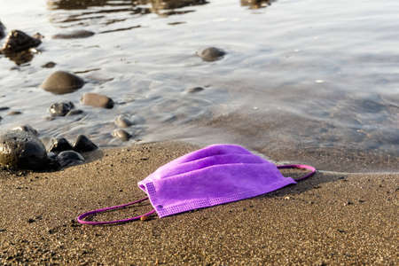 Purple medical mask for protection from coronaの写真素材