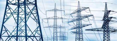 Power lines with power poles for energy supplyの写真素材