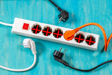 Power strip with five locked and one free socket with plugの写真素材