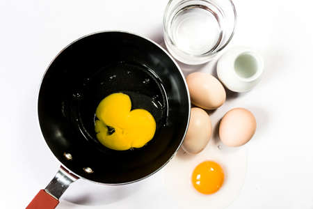 Eggs with  yolk isolated on white backgroundの写真素材