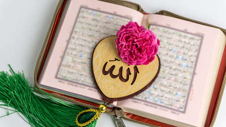 The Holy Quran and Heart(Love) Shaped Tag written in Arabic Allah English meaning of God