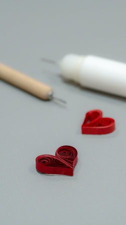 Red hearts and a needle on a gray background. Gift for Valentine's Dayの写真素材