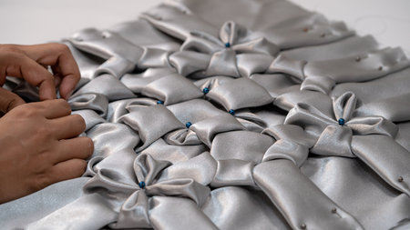 Close-up of the hands of a seamstress working in her workshop