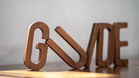Creative Compass: Wooden 3D 'GUIDE' Letters Inspire Perfectionの写真素材