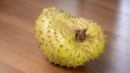 Soursop fruit on wooden table,Noni fruit in Thailand.