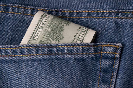 Pile of money in a back pocket.の写真素材