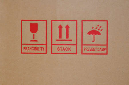 Shipping icons on cardboard box.の写真素材