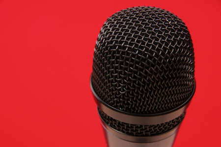 Microphone on red background の写真素材