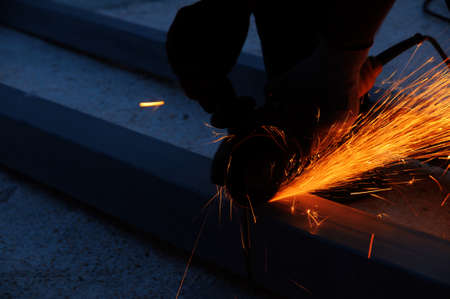 Cutting mettal with grinder.