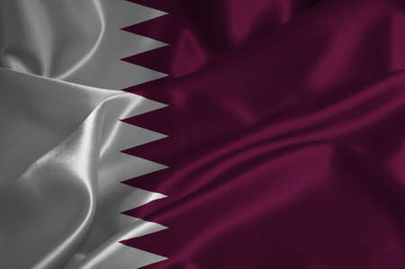 Qatar flag on satin texture.の写真素材