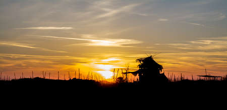 Beach house under sunsetの写真素材