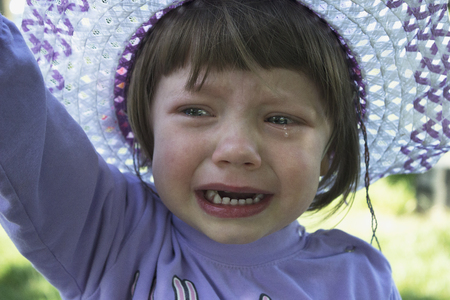 cute small girl cryingの写真素材