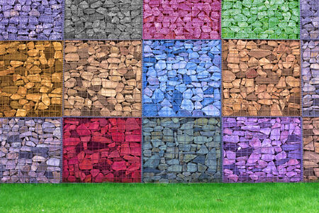 Colorful Abstract Stone Wall perfomance art on grassの写真素材