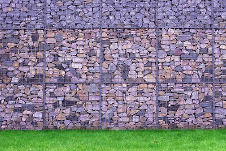 Colorful Abstract Stone Wall perfomance art on grassの写真素材