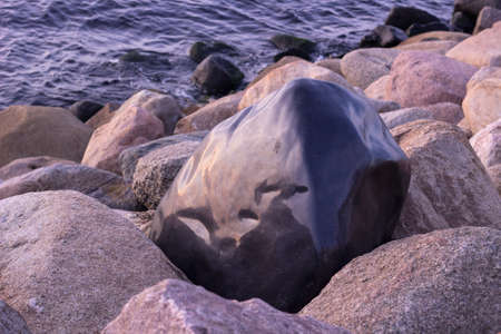 Dark winter sea stonesの写真素材