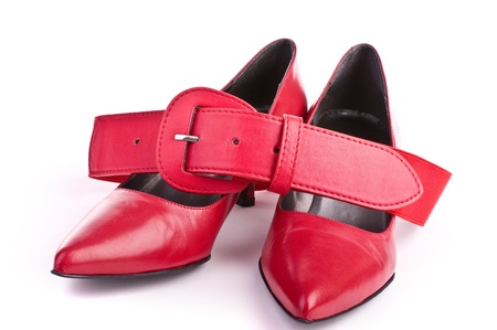 Red shoes with belt isolated on whiteの写真素材