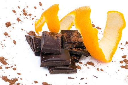 Close-up of chocolate pieces with orange isolatedの写真素材
