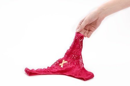 Woman pulling her pink sexy pantiesの写真素材