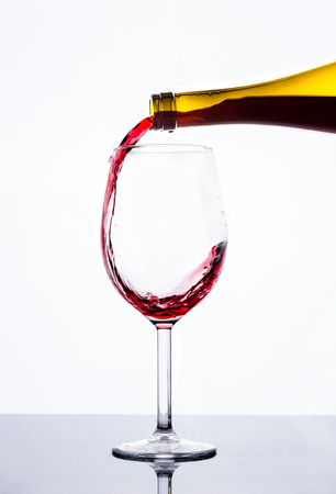 Pouring wine with white の写真素材