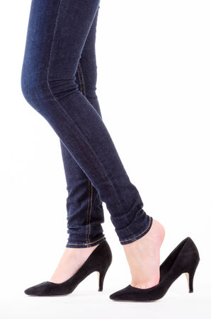 Woman legs in jeans with white backgroundの写真素材