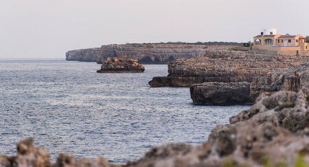 Seascape with rock at sunsetの写真素材