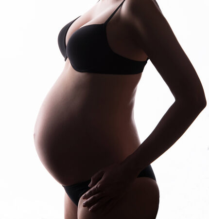 Pregnant woman with white backgroundの写真素材