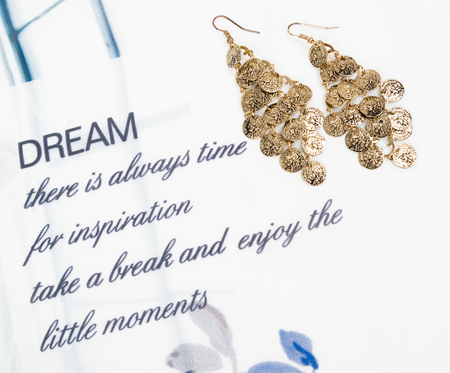 Gold earring with writing from dreamの写真素材