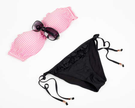 Bikini with sunglasses isolated on whiteの写真素材