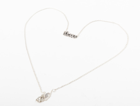 Heart necklace with love label isolatedの写真素材