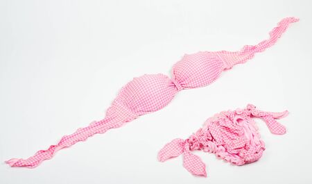 Checked pink bikini isolated on whiteの写真素材