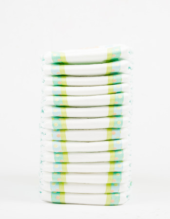 Stack of Diapers isolated on whiteの写真素材