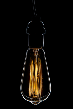 Vintage Light Bulb on Black Backgroundの写真素材