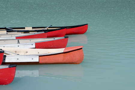 Canoes on a glacier fed lake in Banff National Park, Alberta, Canadaの写真素材