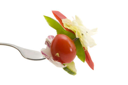 Fork full of salad on a white backgroundの写真素材