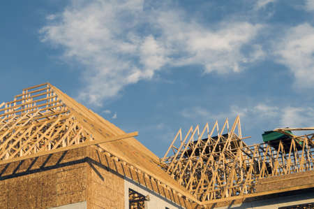 Frame construction of a large building with copy space in the blue sky