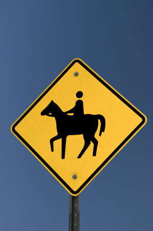 Horse Yield Sign on deep blue skyの写真素材